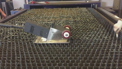 Laser slag cleaner for laser cutting table cleaning